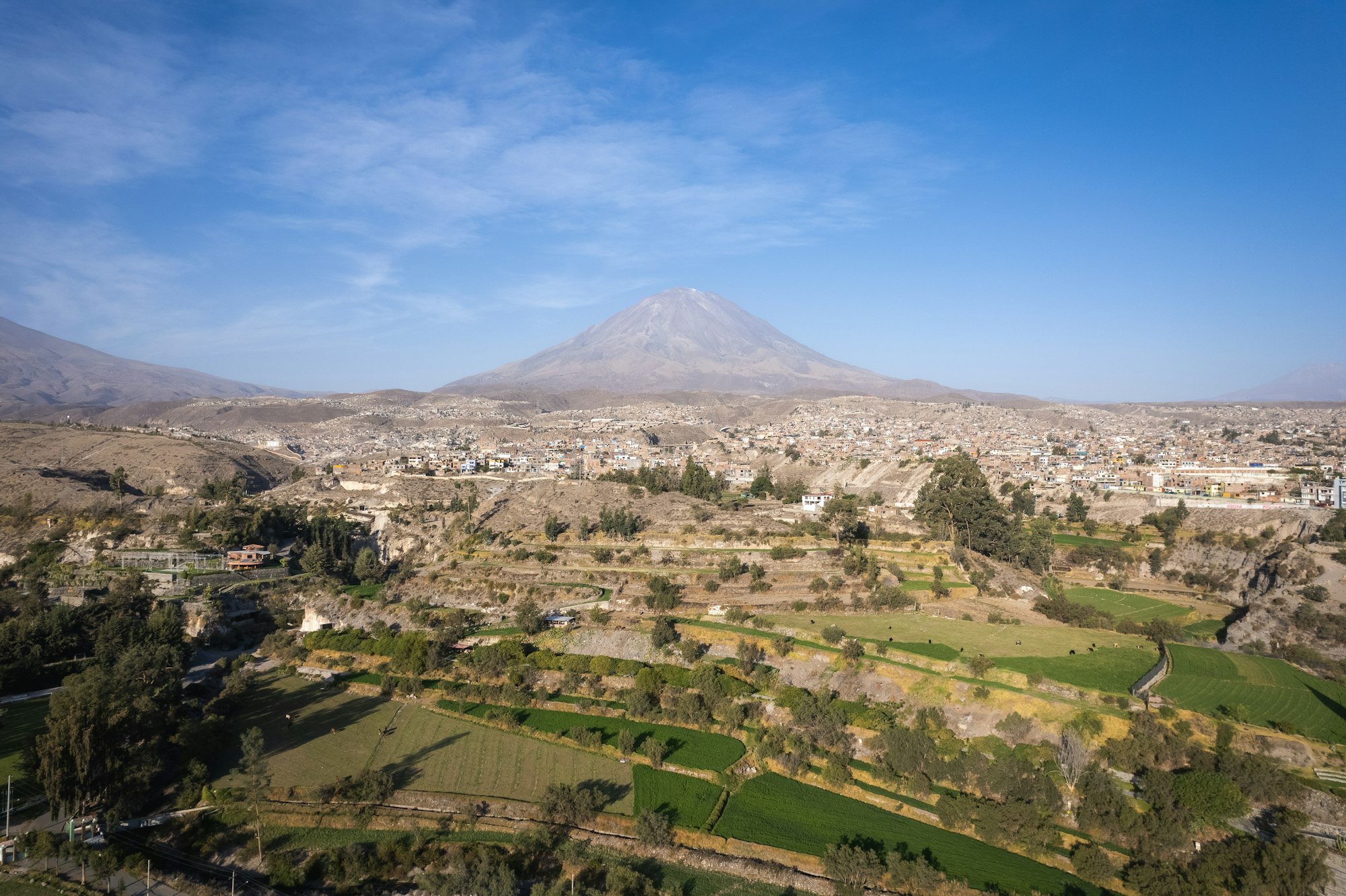 Agricultural landscape and the rustic Misti Volcano in the background