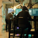 Woman hacker planning phishing and espionage at night